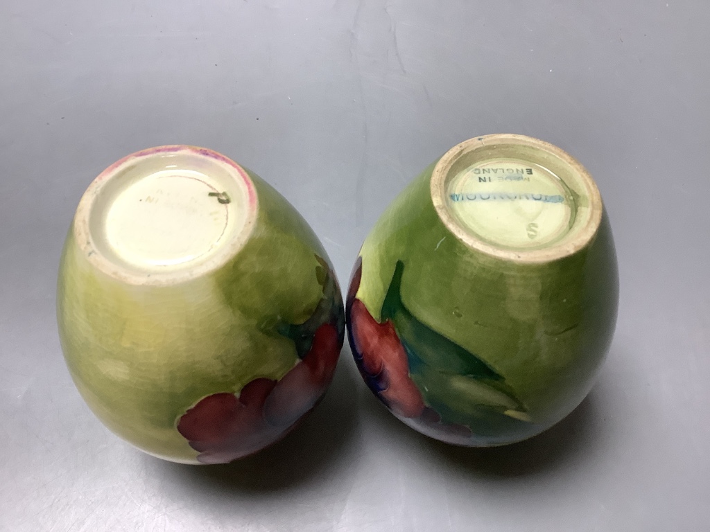 A pair of Moorcroft yelow ground Hibiscus vases, height 9cm